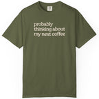 Probably thinking about my next coffee T-shirt