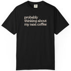 Probably thinking about my next coffee T-shirt