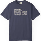 Probably thinking about my next coffee T-shirt