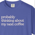Probably thinking about my next coffee T-shirt